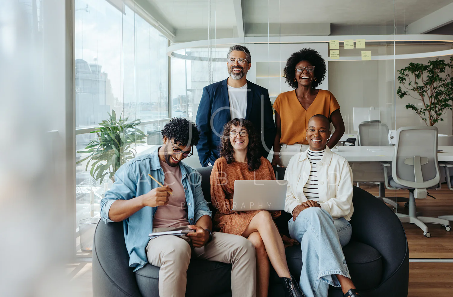 Happy Tritorc employees collaborating in modern office environment
