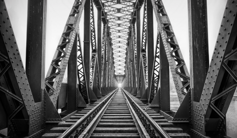 Construction sites with cranes, infrastructure projects, and heavy machinery bolting solutions